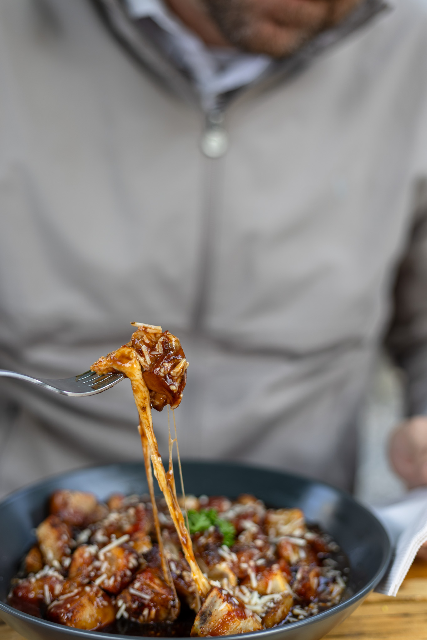 Brisket poutine with smoked brisket, roasted potatoes, cheese curds, mushrooms, and honey garlic drizzle at The Emerald Light restaurant